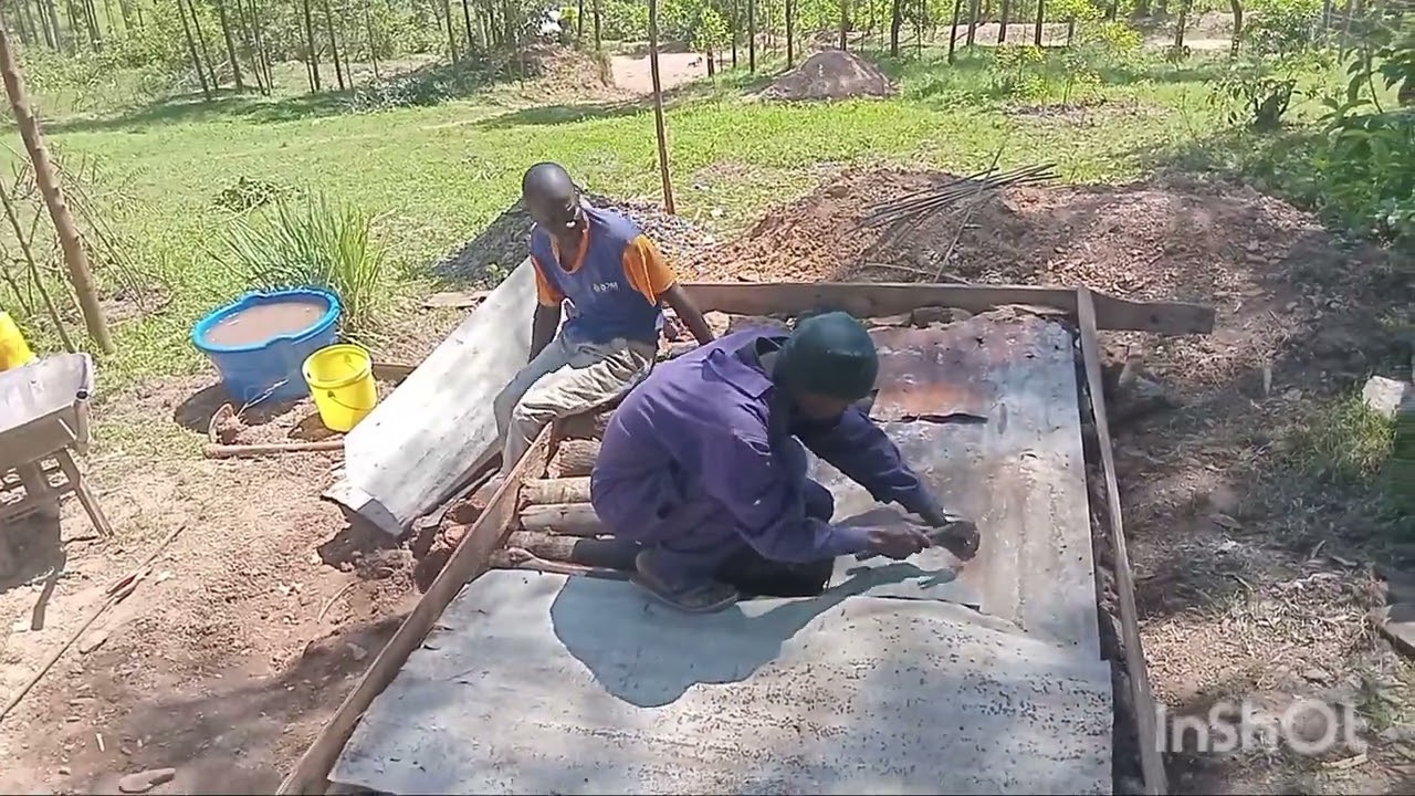 HELPING VILLAGE MASON IN SLABING OF HER TOILET 