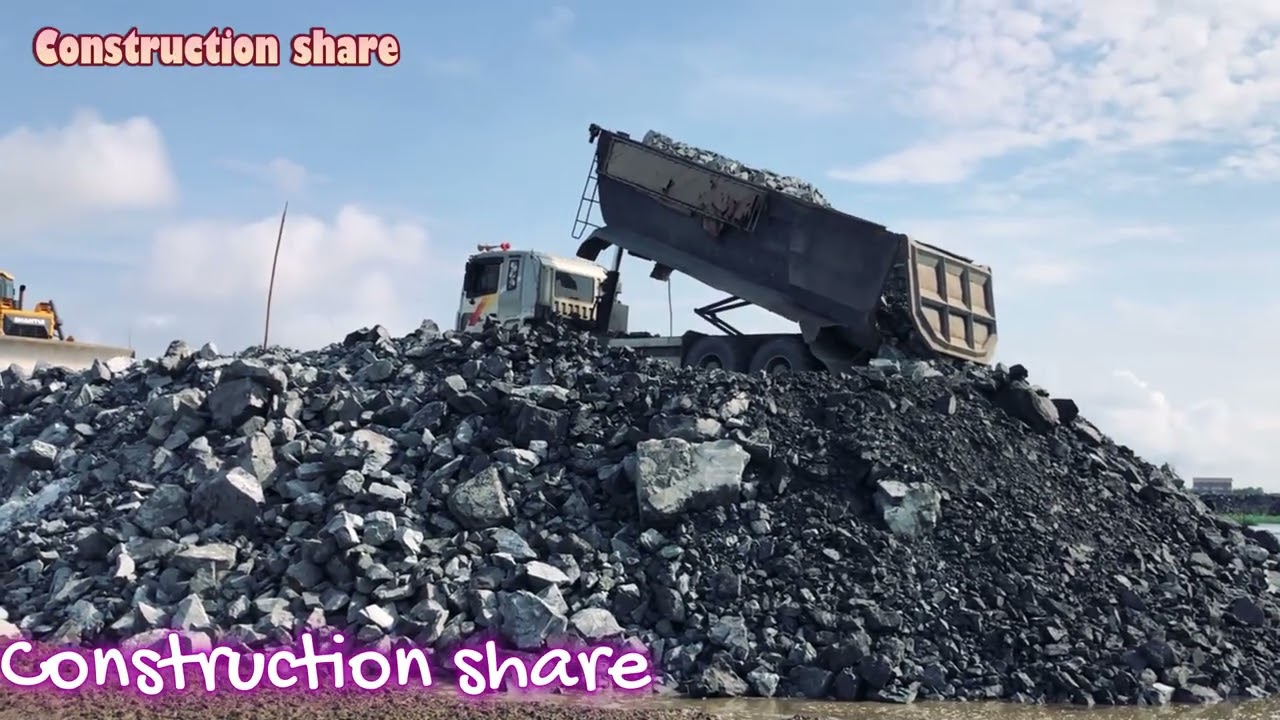Watch This Bulldozer Move a Mountain of Rocks!