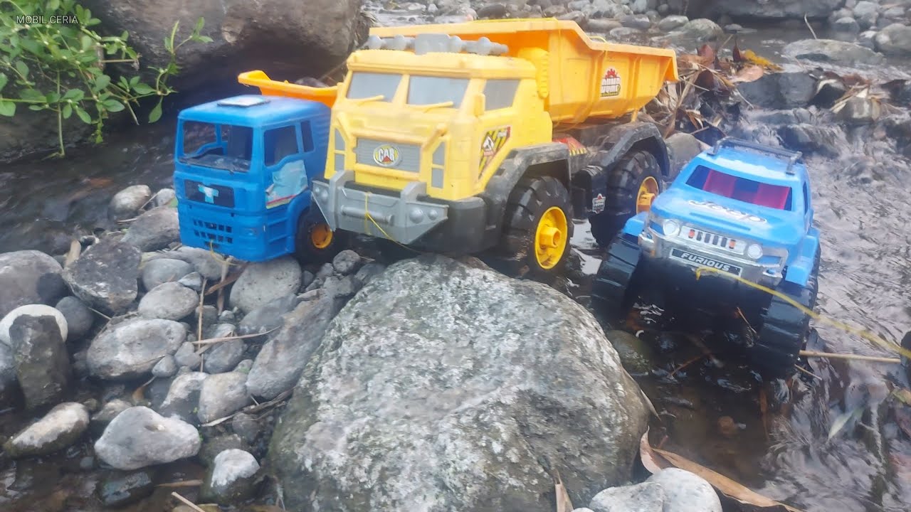 CLEAN BLUE CABIN DUMP TRUCK, YELLOW DUMP TRUCK, BLUE JEEP WITH RIVER WATER