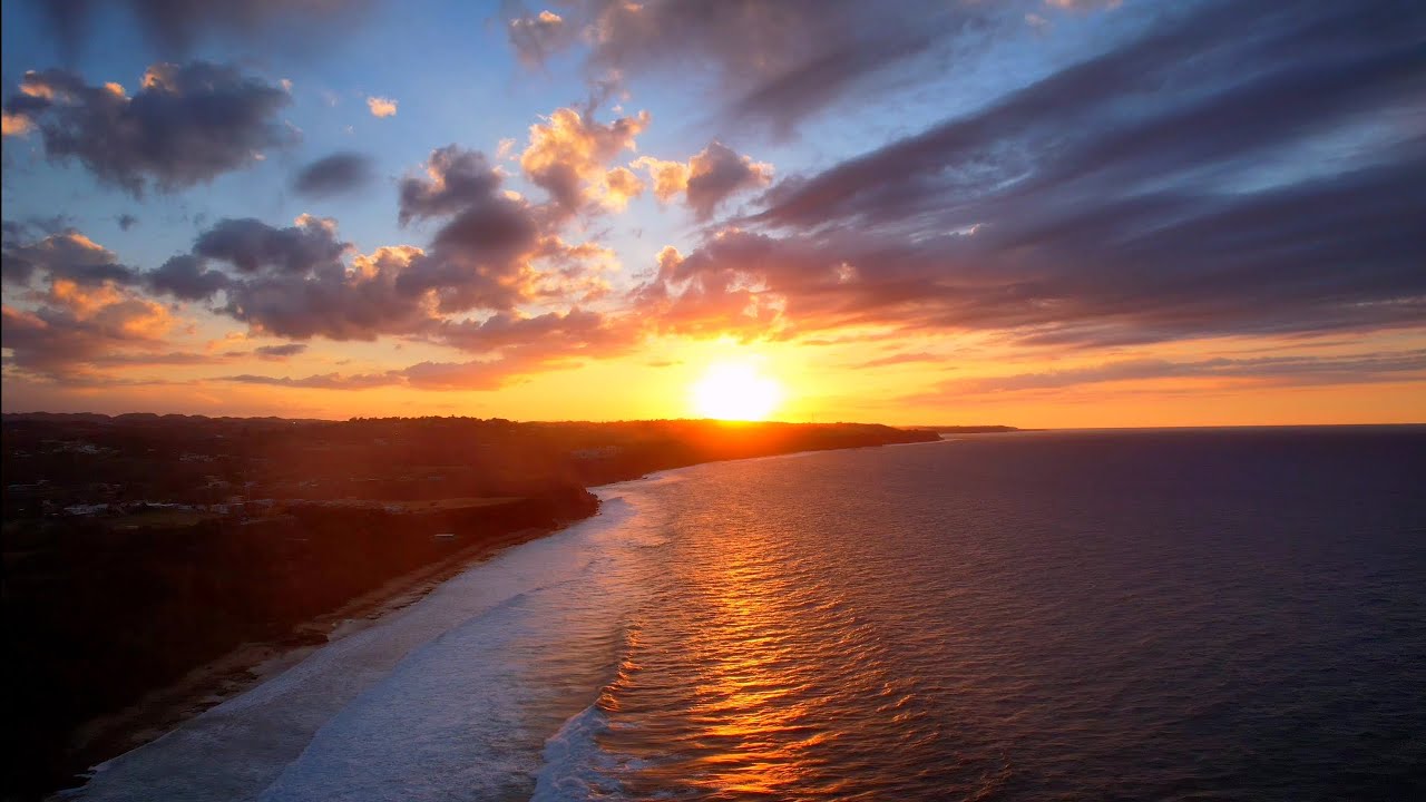 Puerto Hermina in Quebradillas, Puerto Rico - cinematic drone footage of a beautiful sunset.