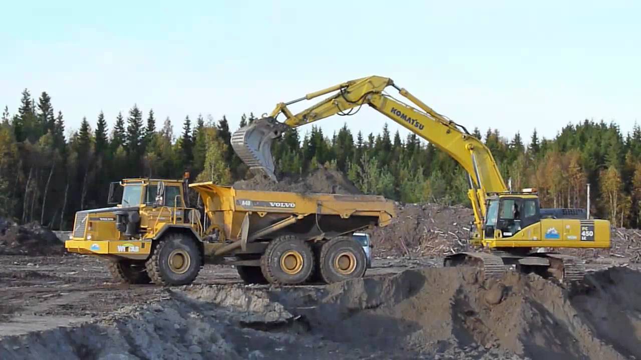 Komatsu PC450LC-7 Loading Volvo A40 and Volvo Trucks