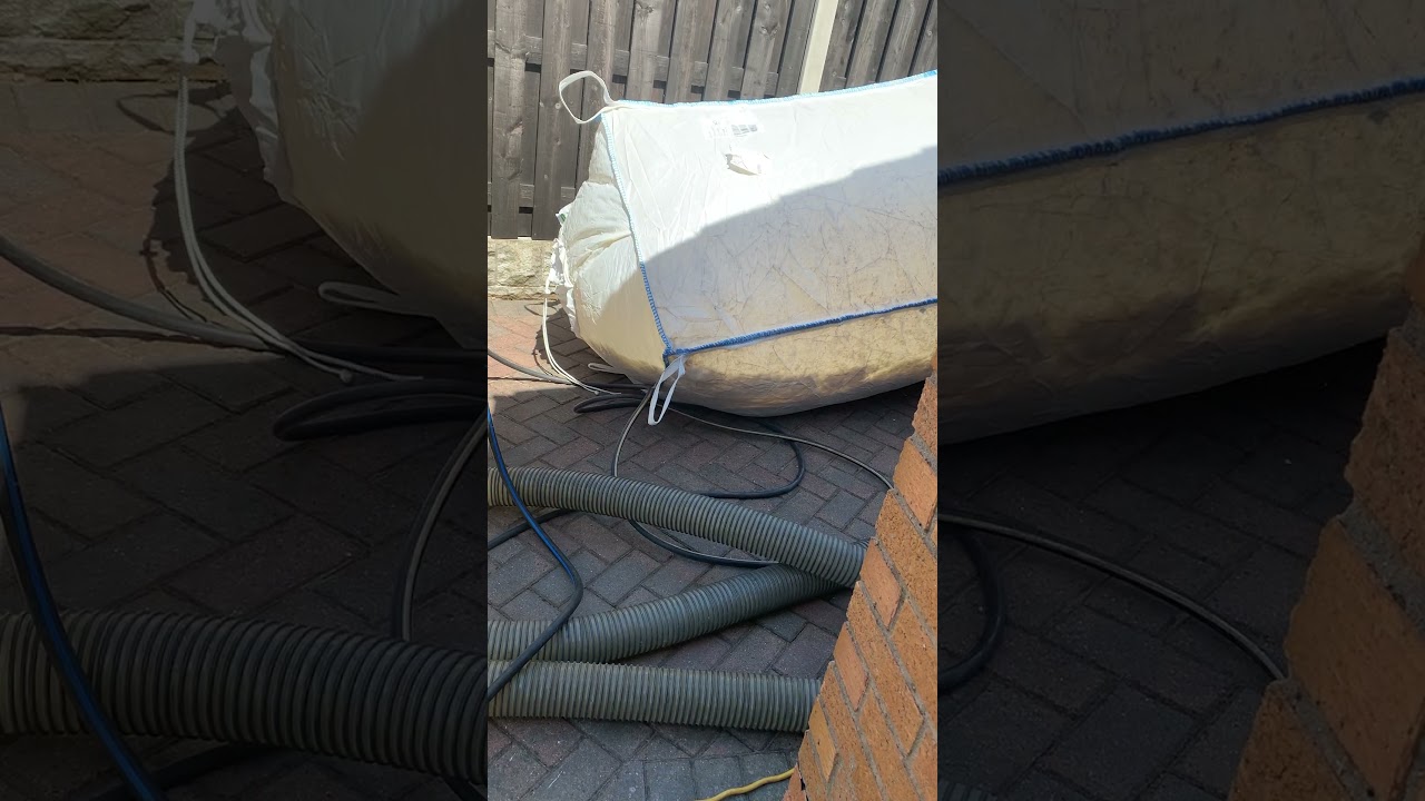 Extracting cavity wall insulation using a cavityvac extraction machine