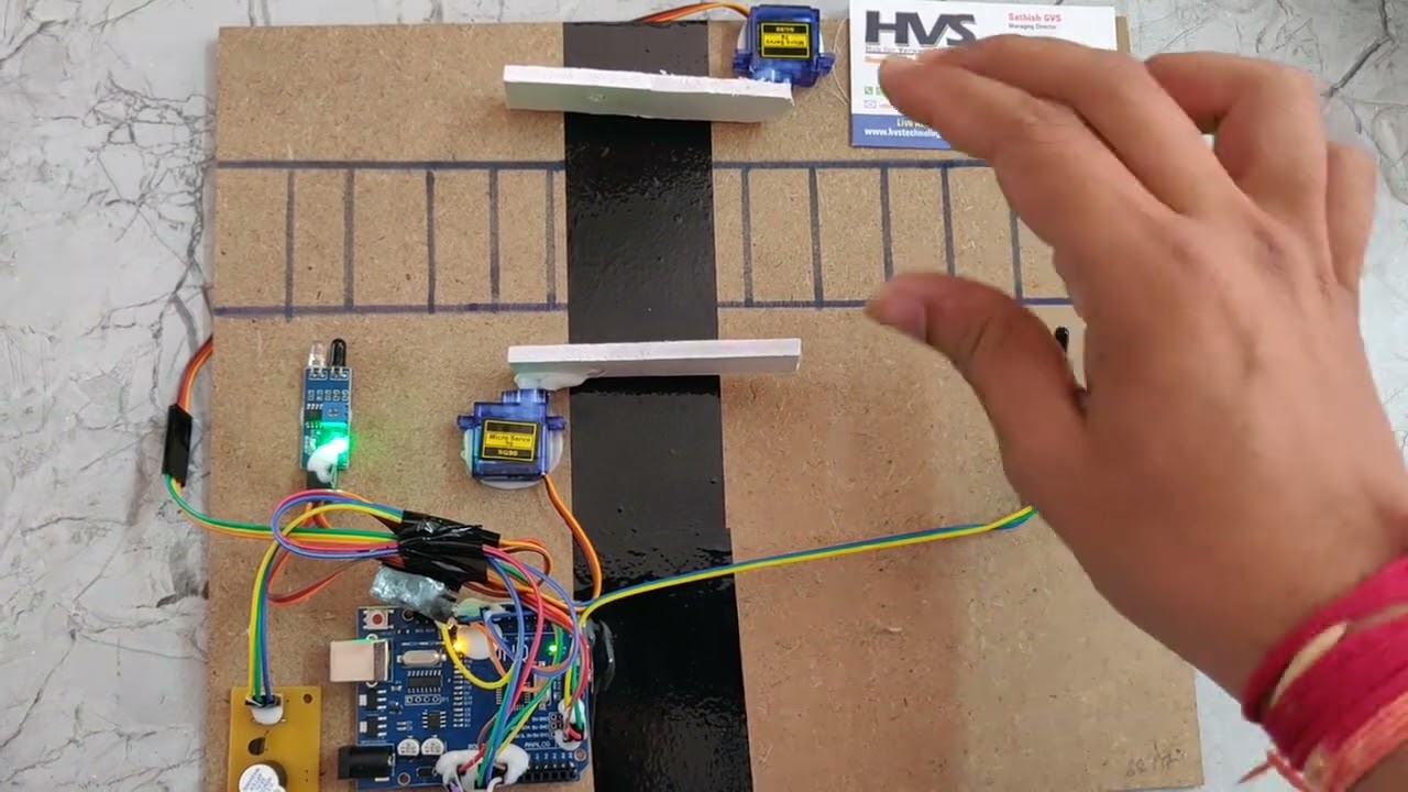 Automatic Railway Gate Controlling System using Arduino UNO and Servo Motors