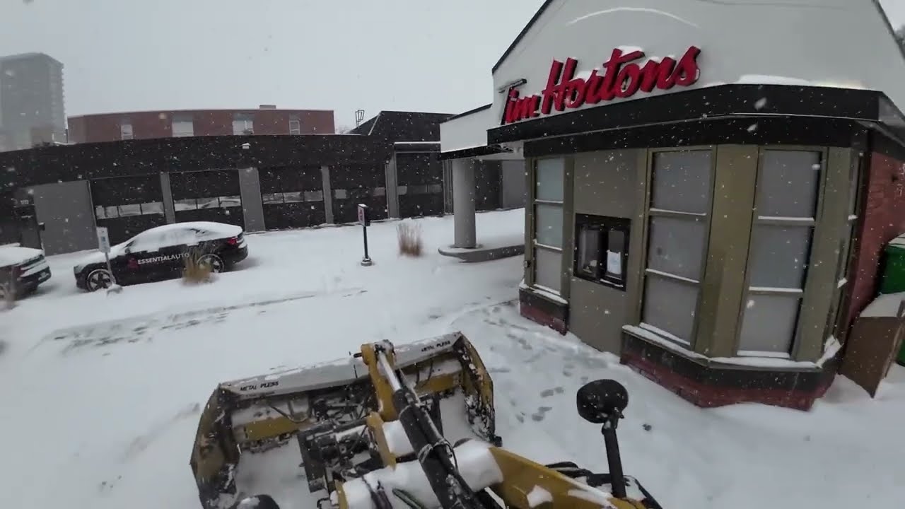 Plowing a Tim Hortons during a snow storm