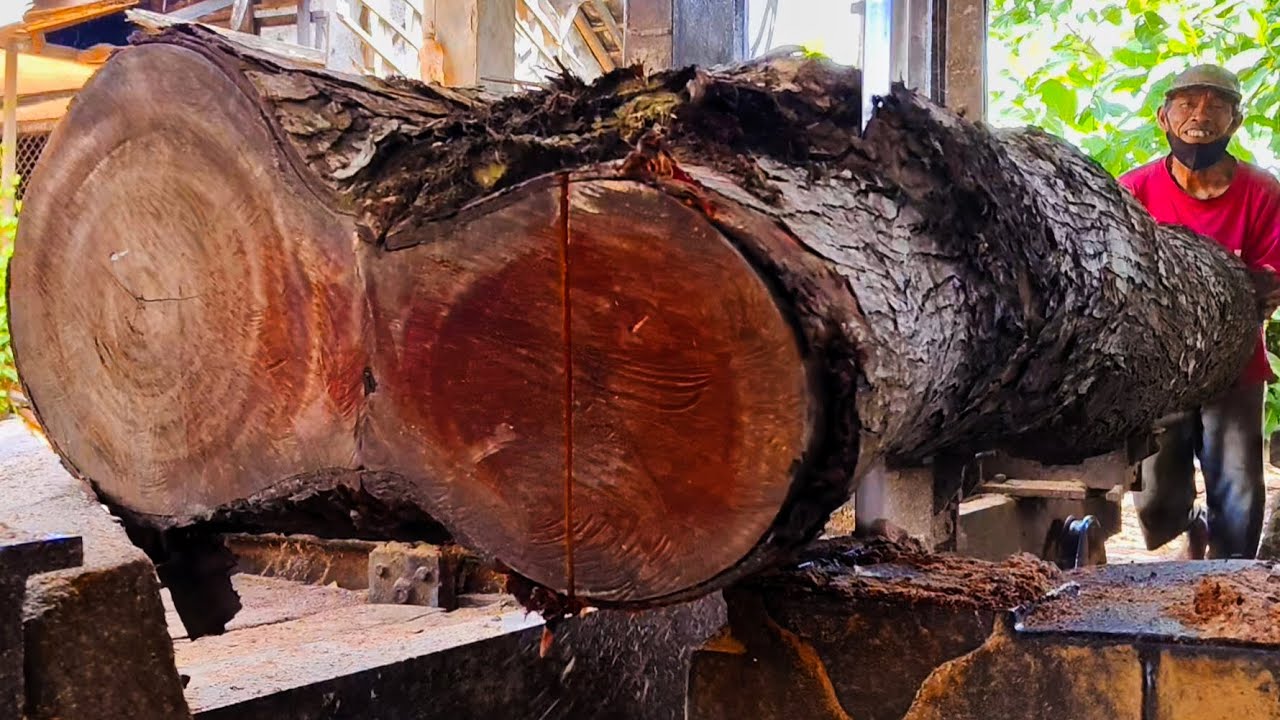 Splitting to transform antique wood into tabletop board material at the sawmill 