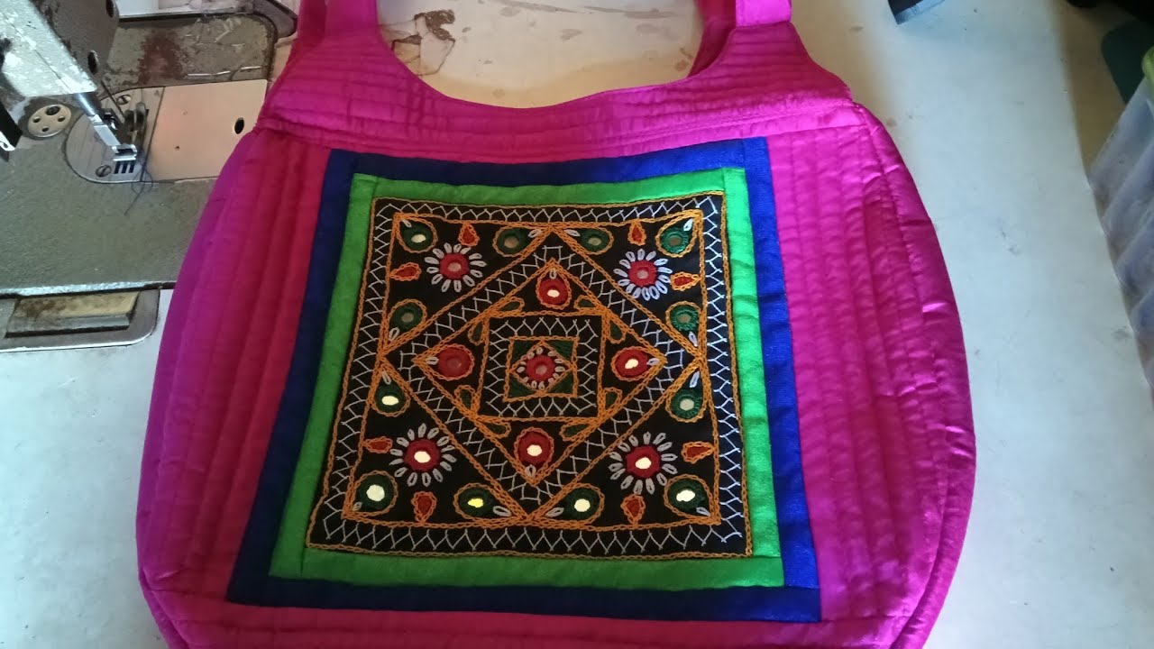 Hand work kiye hue page se banaya bag