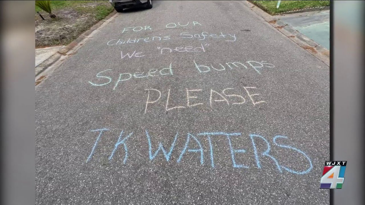 Woman writes message for Sheriff Waters on the street about getting speed bumps in her neighborhood