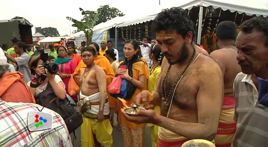 Hindu devotees fulfilling prayers in Batu Caves