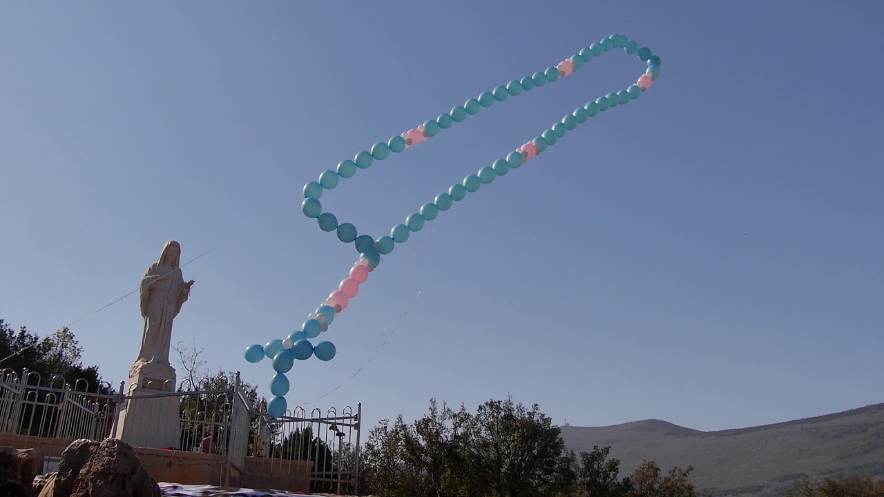 Large rosary balloon released with a prayer above Medjugorje