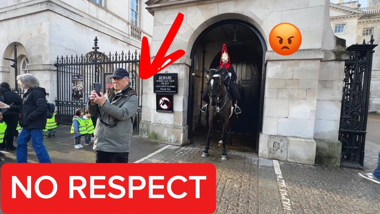 “Disrespectful Tourist Stands Inside the White Box”