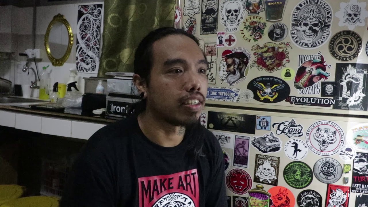 getting handpoked tattoo at Orangutan by Sabah Tattoo artist Limuel Estrop