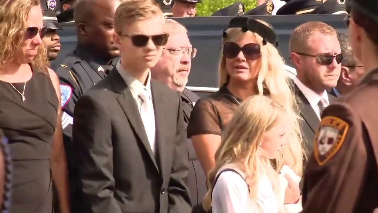 Raw: Bagpipes and procession for fallen officer Michael Langsdorf