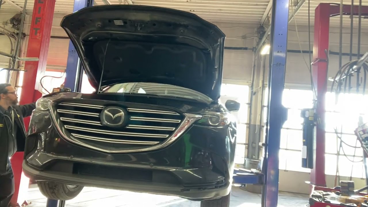 Inspection and oil change for a 2021 Mazda CX-9 at 10X speed. 