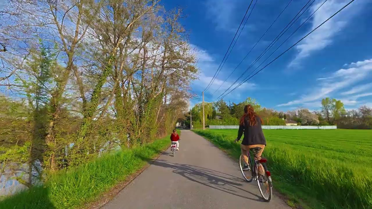 Cycling along the Yonne River on a summer sunset. Burgundy, France