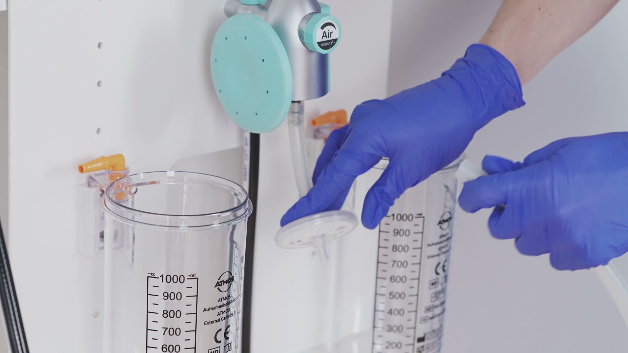 Fixation of ATMOS disposable suction system at MEDAP FINA AIR Portable Aspiration Unit