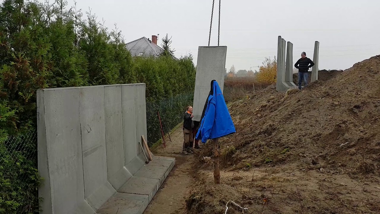 Budowa Muru oporowego z gotowych element&oacute;w betonowych prefabrykowanych.