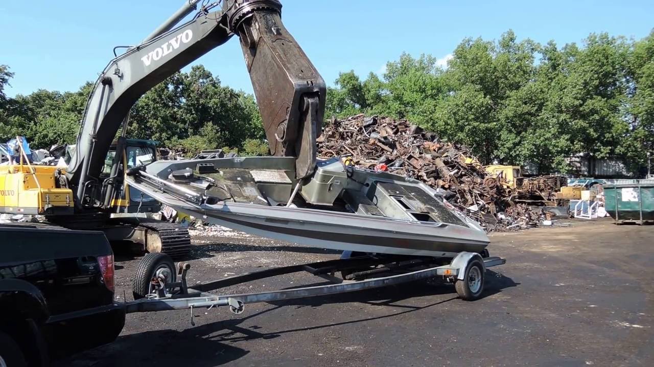 Old Fiberglass Boat to the Dump