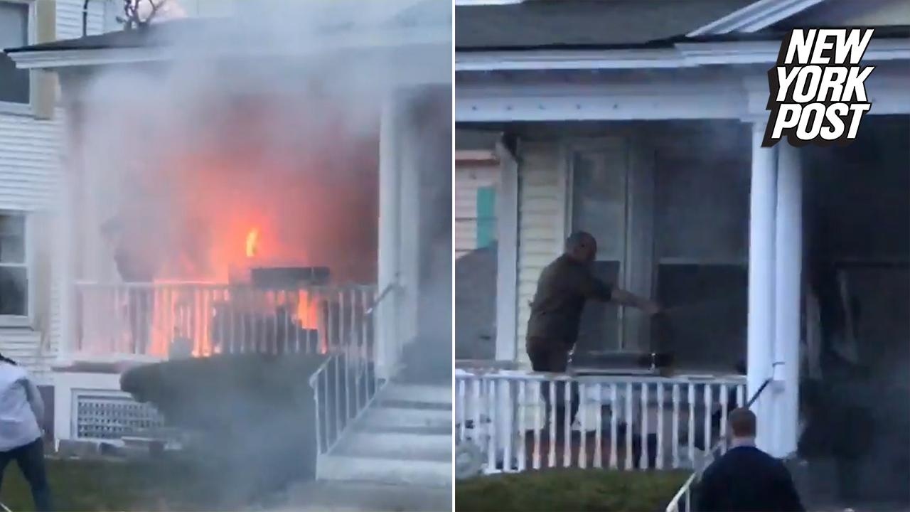 Heroic UPS guy puts out a fire with a garden hose | New York Post