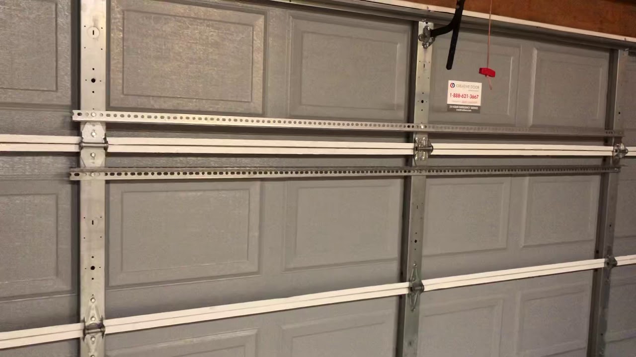 Quick, easy, and inexpensive fix for a buckling, popping Garage door