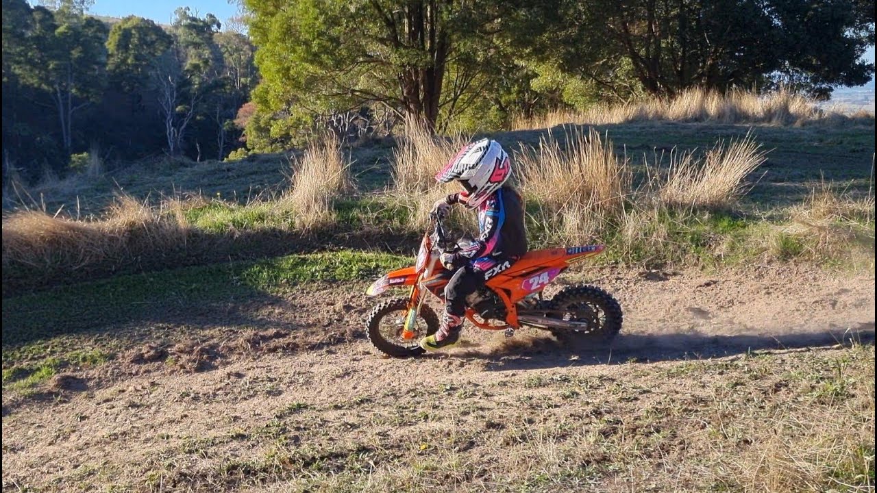 8 y/o Mimi chases brother Mason around the MX track