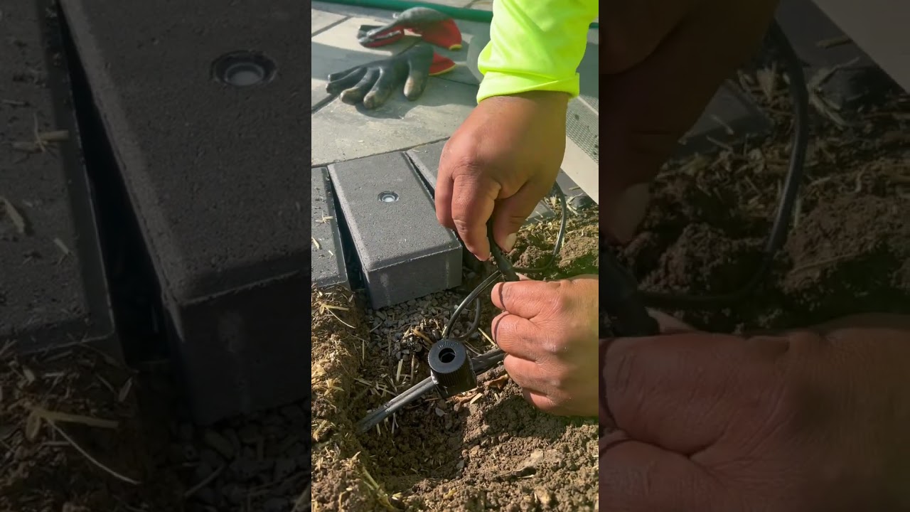 Installing landscape lights in our pavers 😳