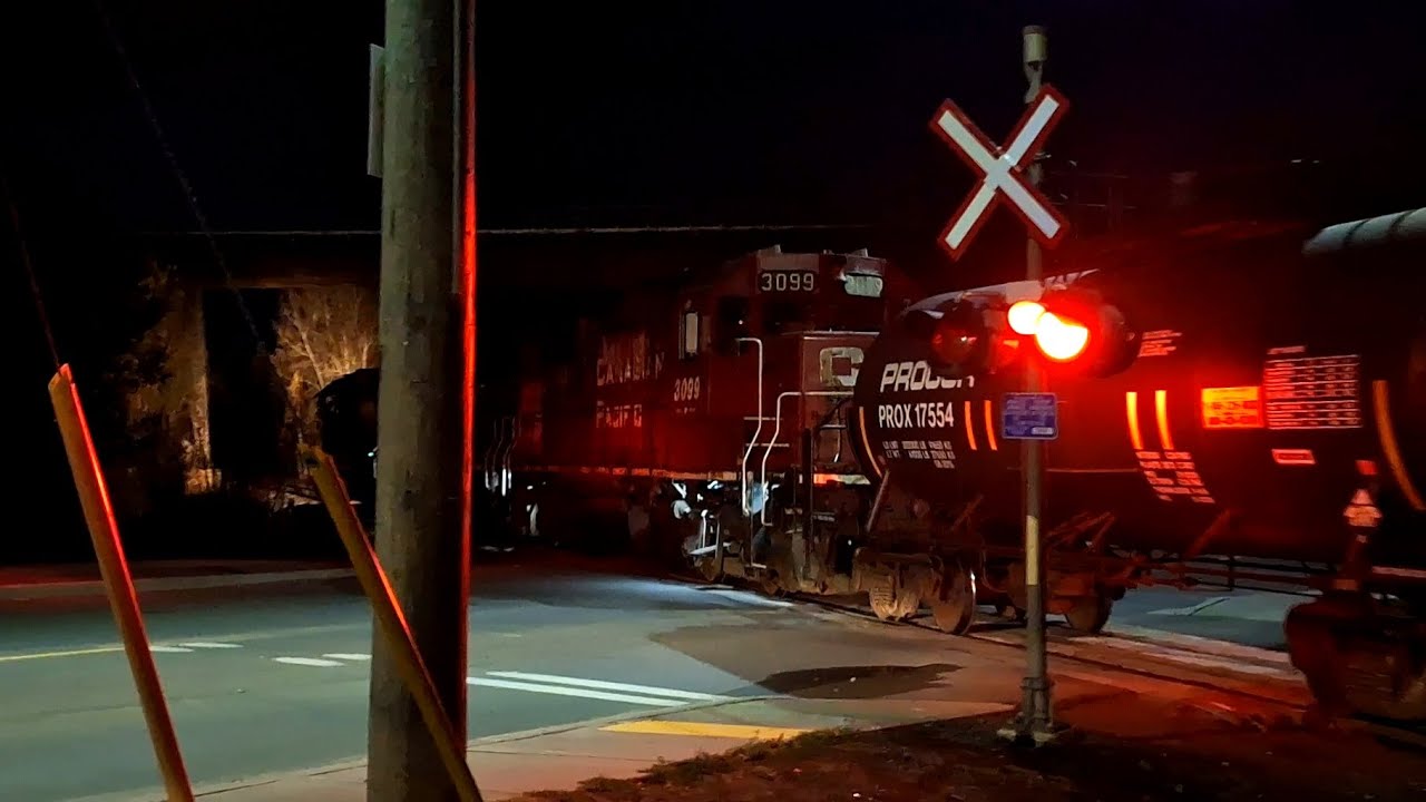 LOCAL FREIGHT TRAIN APPROACHES SUDBURY YARD WITH CLASSIC TRIO FOR POWER! BRONZE BELL ON SD60!