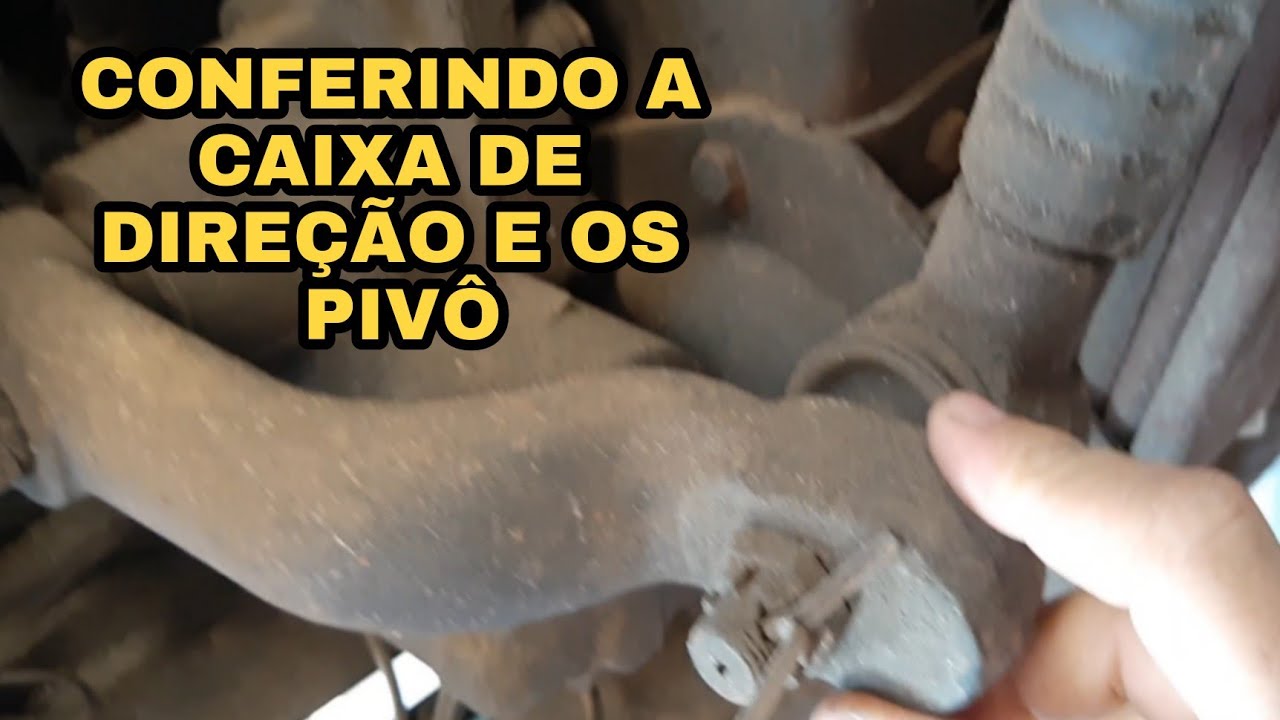 Conferindo se a Caixa de direção  e o pivô se estão com Folga do VW 7 90.