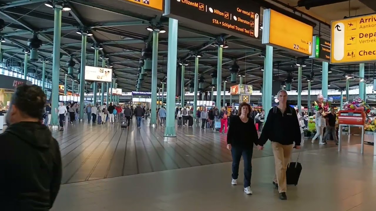Schiphol Airport how to catch a train to Amsterdam