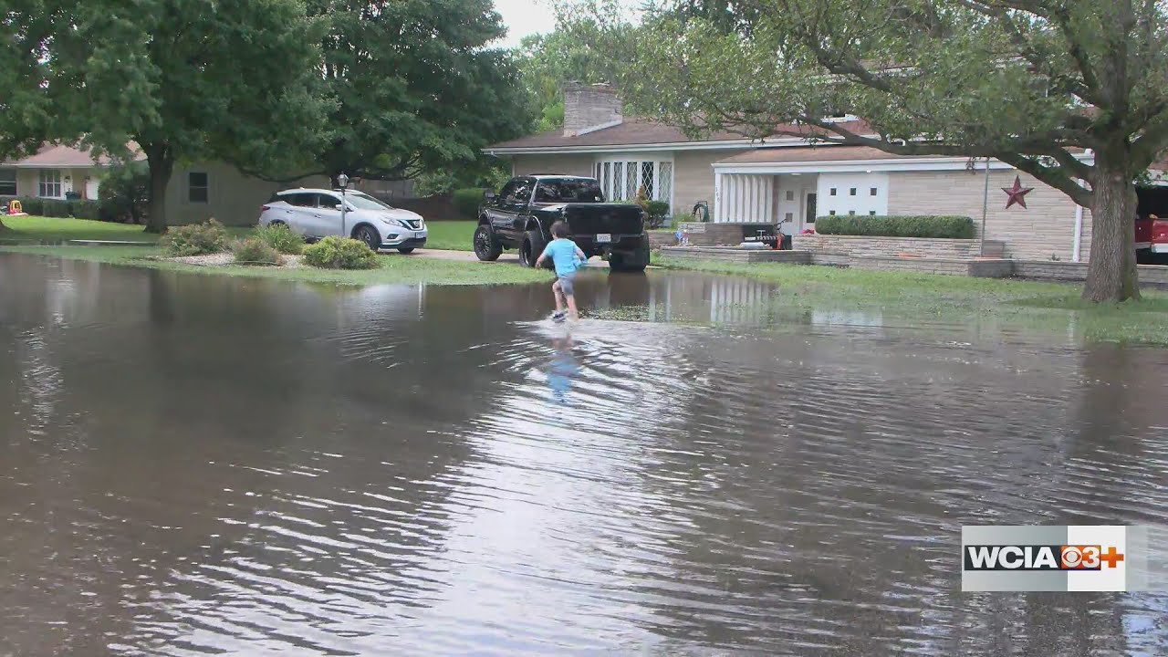 Flood waters fill neighborhood streets and homes in Champaign Co.