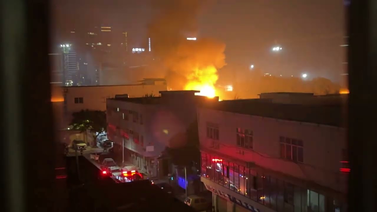 Fire with explosions erupts in outdoor parking lot in Guangzhou, China