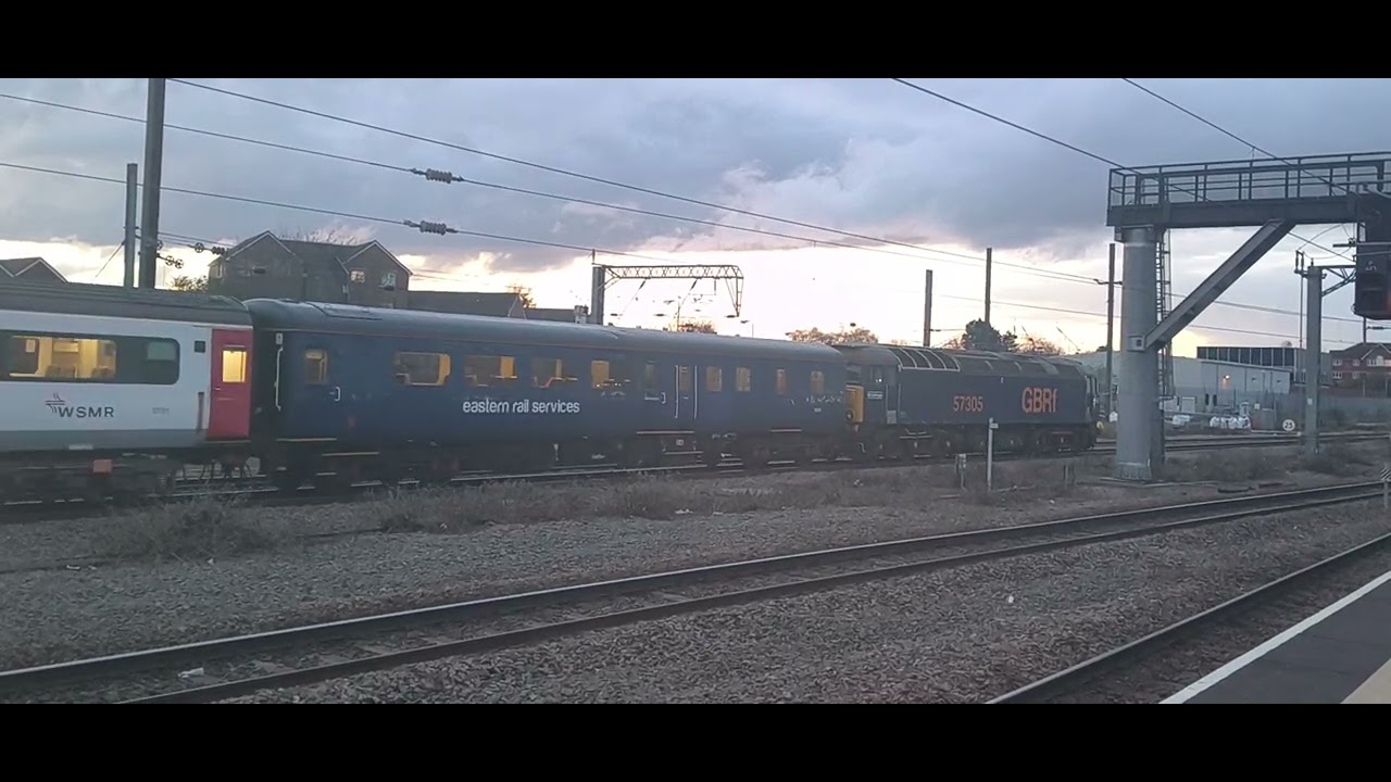 57305 and 57303 on an empty coaching stock