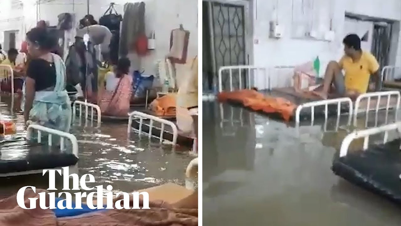 Hospital and homes submerged in India as floods kill more than 100