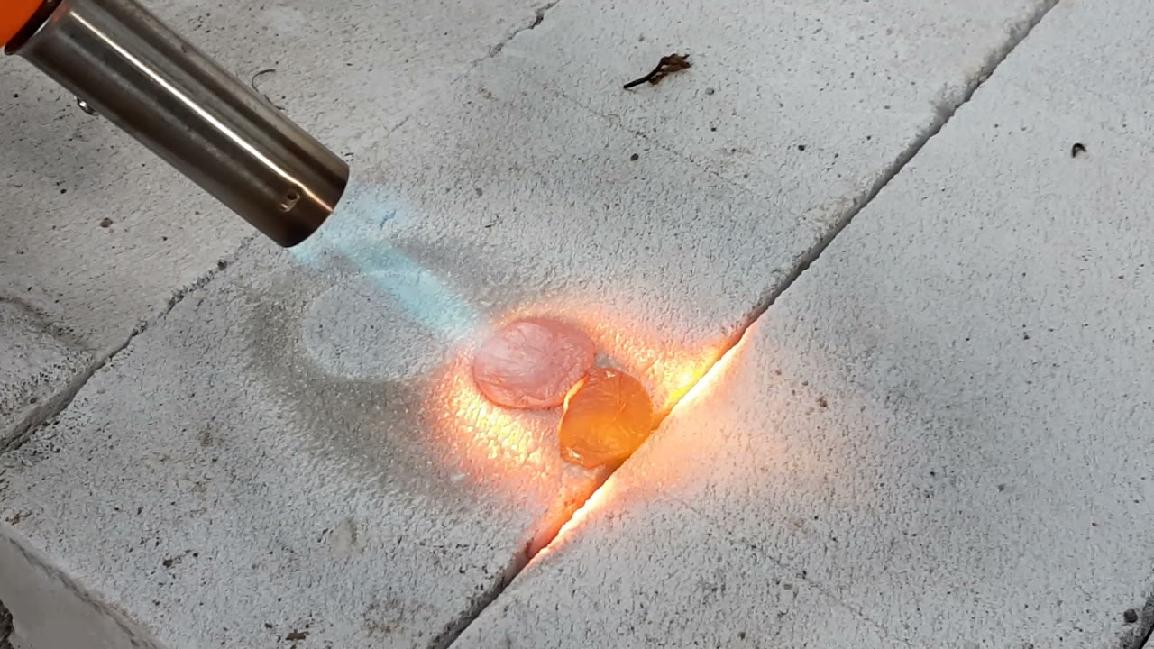 Eksperimen melelehkan koin dengan torch