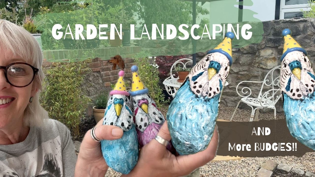 Garden landscaping and budgie sculptures
