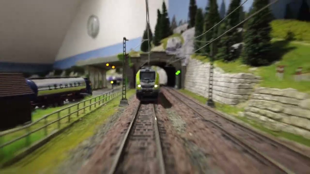 Powerfull STADLER EURODUAL locomotive in cab and frontal view pulling a series of tankcars