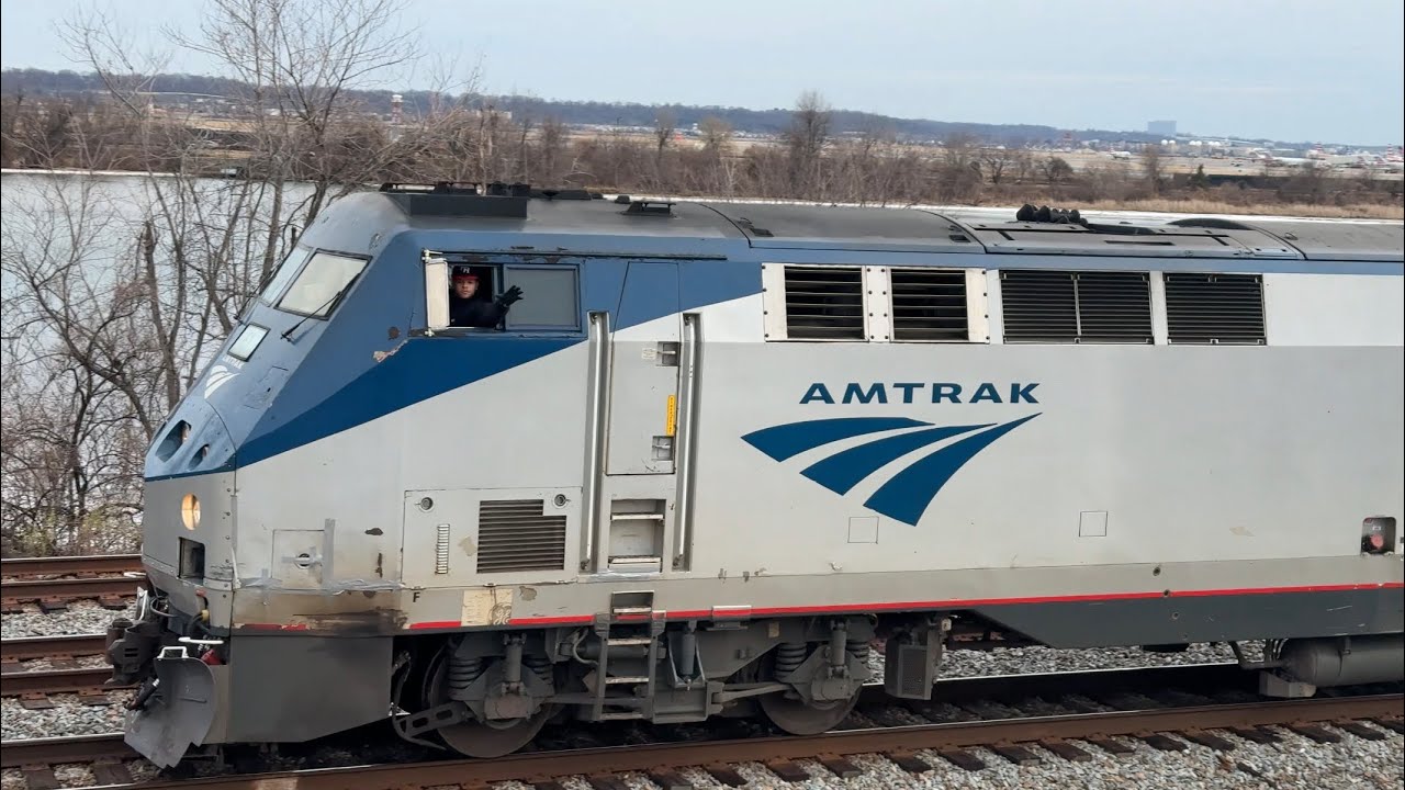 Amtrak #80 the Carolinian to New York, clears Long Bridge Park with a friendly crew on 01:24:26