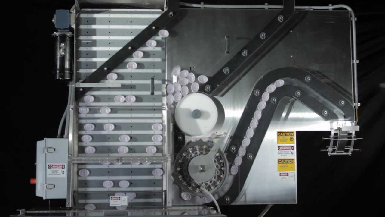 Pack West Machinery - Cap Orienting System for Oval Caps