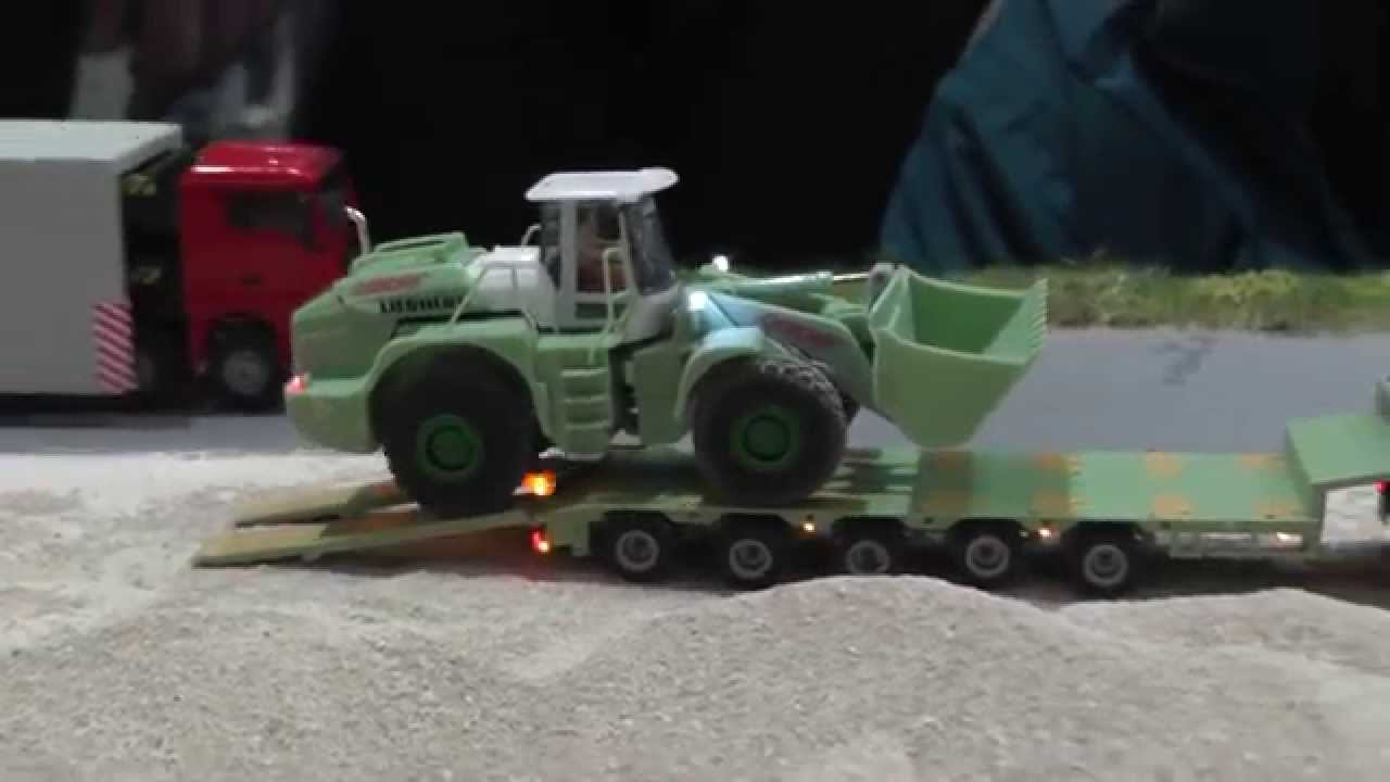 Liebherr Radlader der Firma Geiger bei der Arbeit und anschließendem Abtransport, RC 1:87
