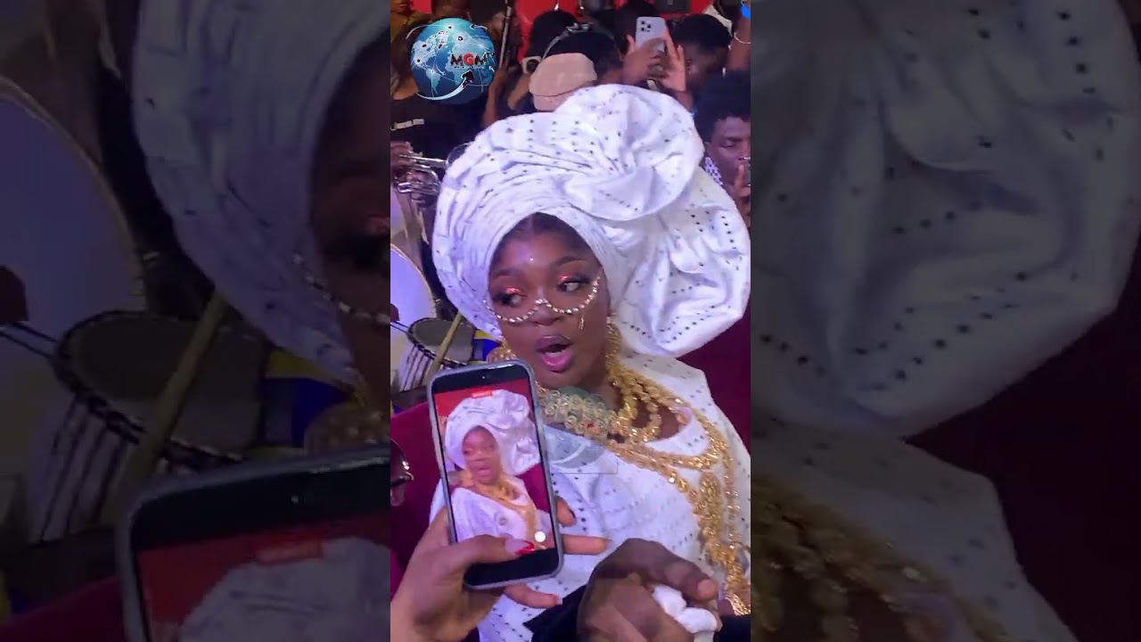 PELLER WELCOME ENIOLA BADMUS AT HER ENTRANCE TO THE MOVIE PREMIER OF LOVE AND NEW NOTE....