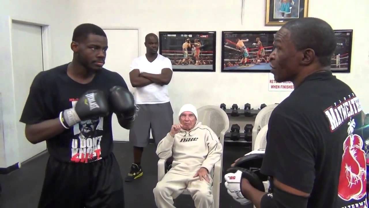 Floyd Mayweather and Andrew Tabiti working mitts
