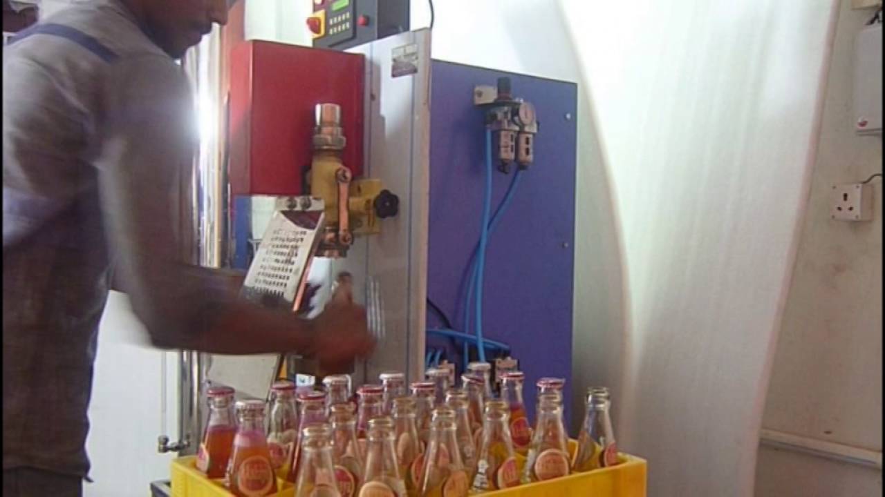 Akshay Industries - Pneumatic Glass Bottle Soda Filling Machine Single Head Semi Automatic