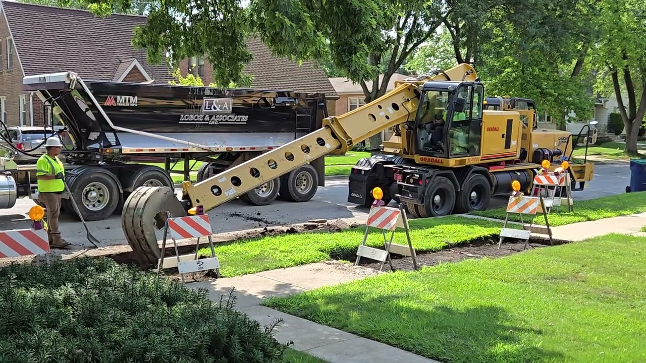 Gradall sidewalk and curb removal (part 2)