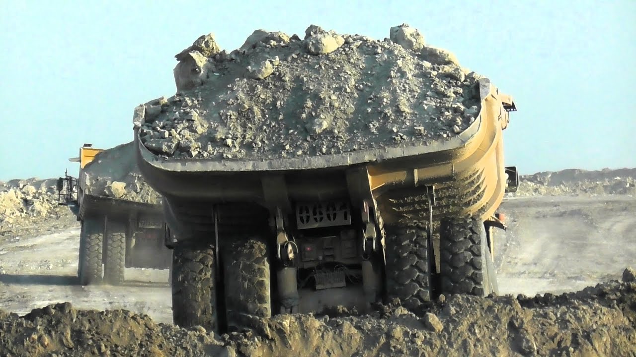 Heavy Dumpers in Action: Komatsu HD785 & Caterpillar 777 Dumping at the Disposal Area
