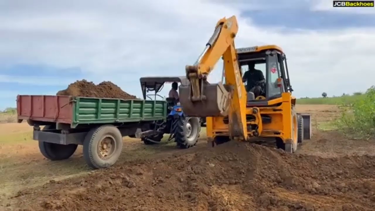JCB 3DX Loading Mud in Sonalika 47 Rx Swaraj 735 FE John Deere 5050