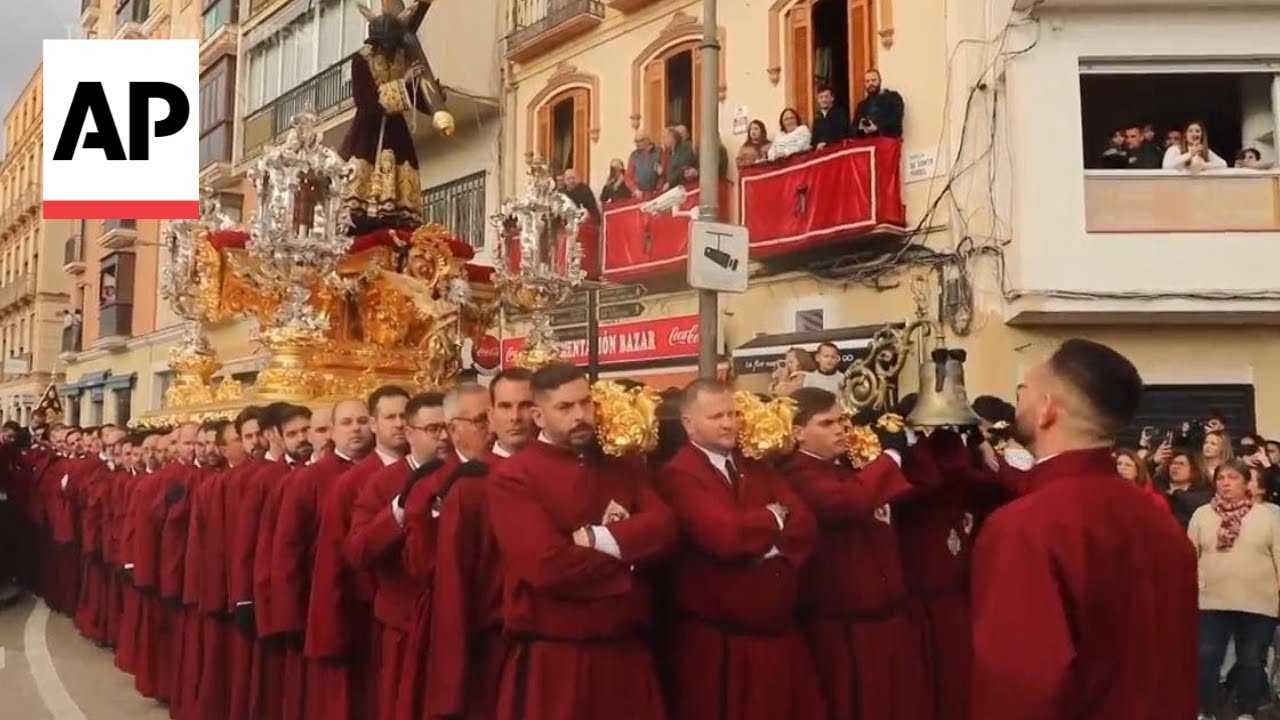 Easter procession takes to the streets of Malaga in Spain