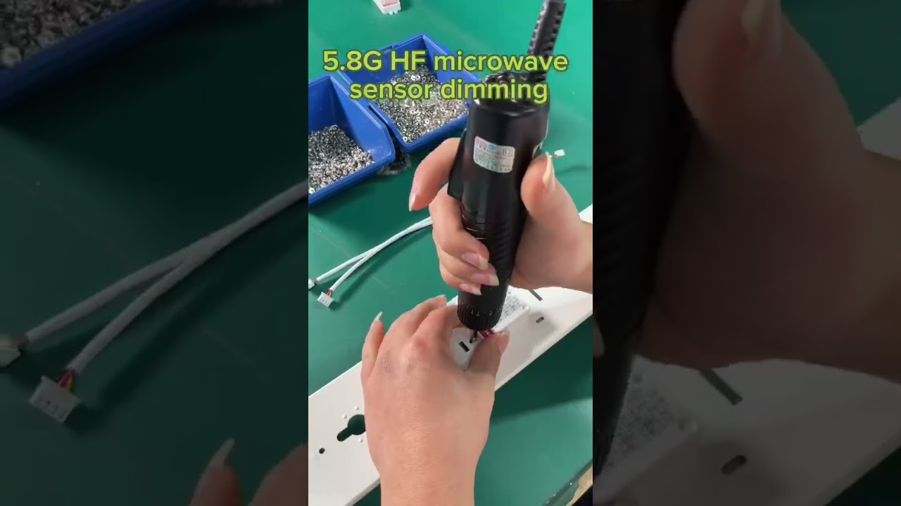 How does the microwave sensor work in LED light fixtures