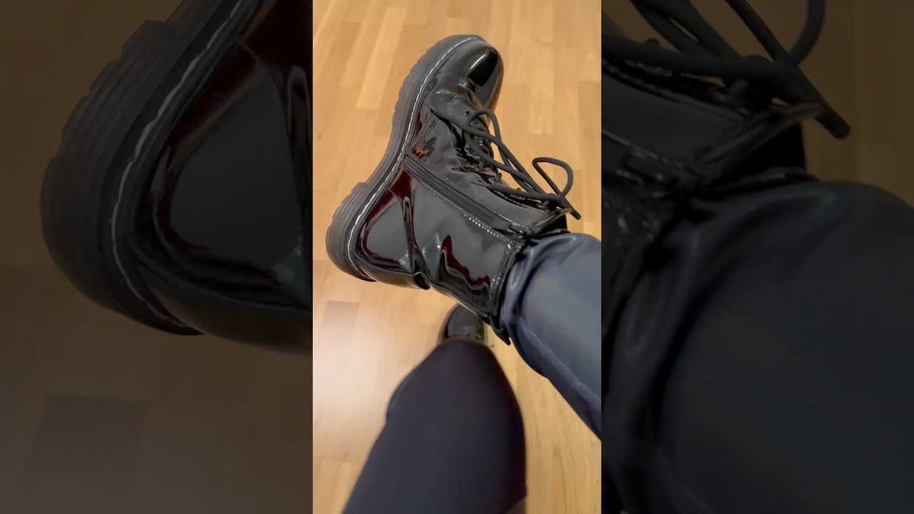 Black leather boots Girl feet sweaty black socks with Nike Nylon Pants