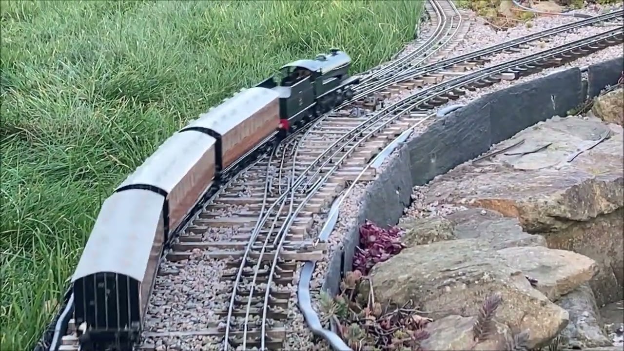 0 gauge in the garden - The first train of Spring, a Bassett Lowke clockwork 4-4-0 & Leeds carriages