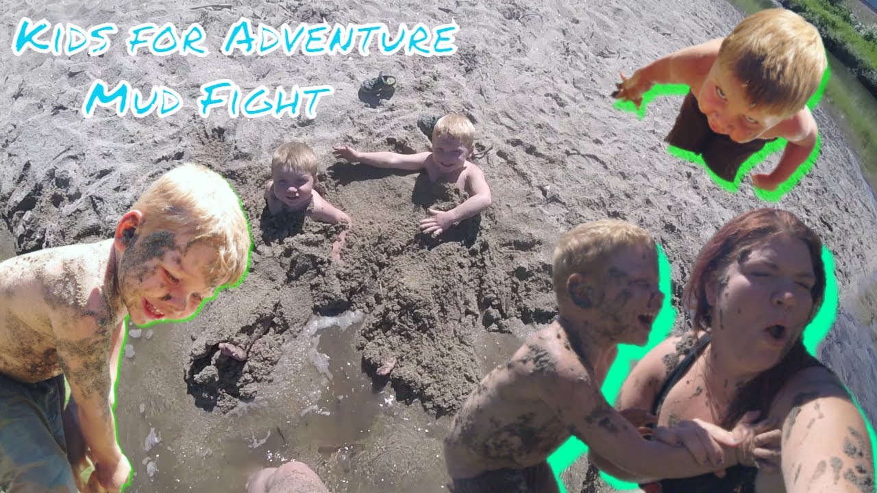 Kids for Adventure have a mud fight while swimming on a hot day.