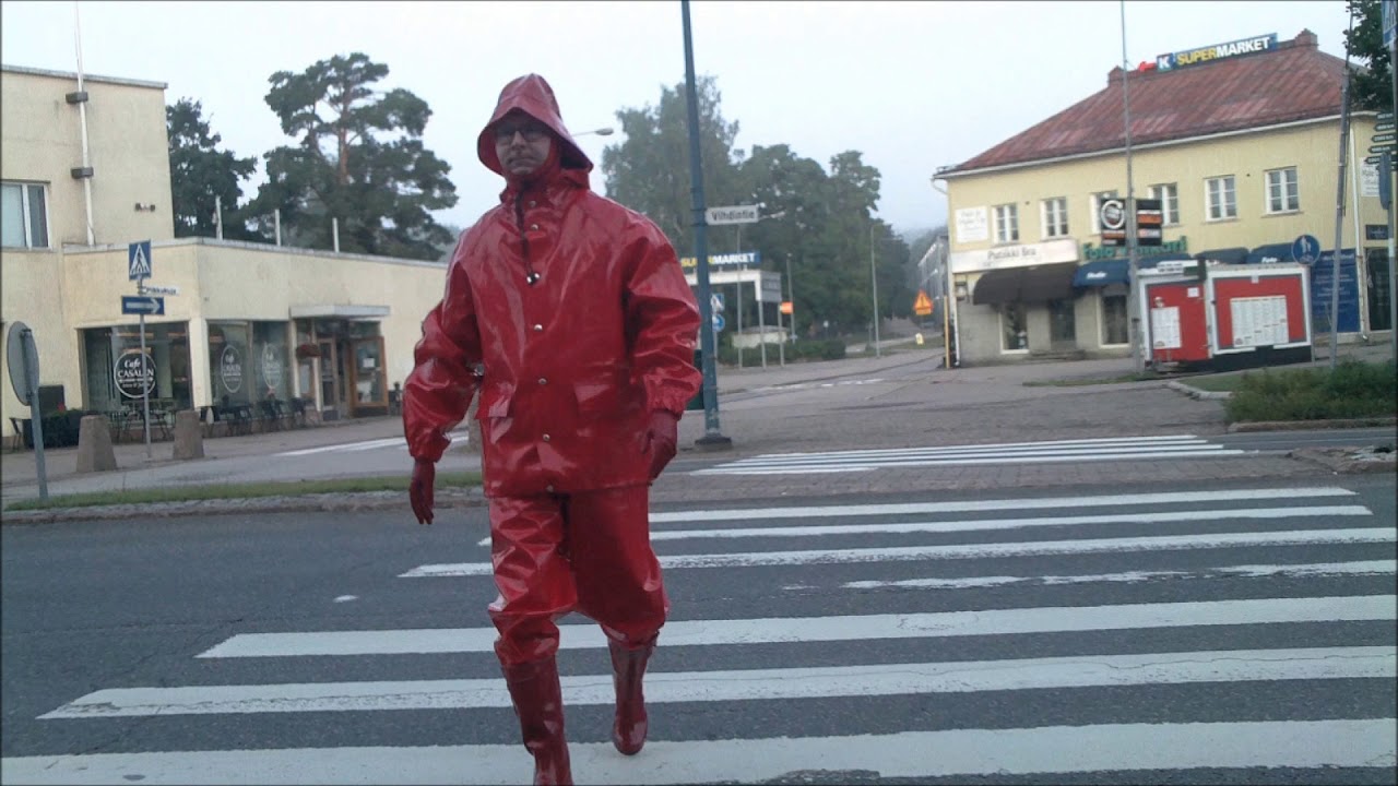 public walk in shiny red rainwear